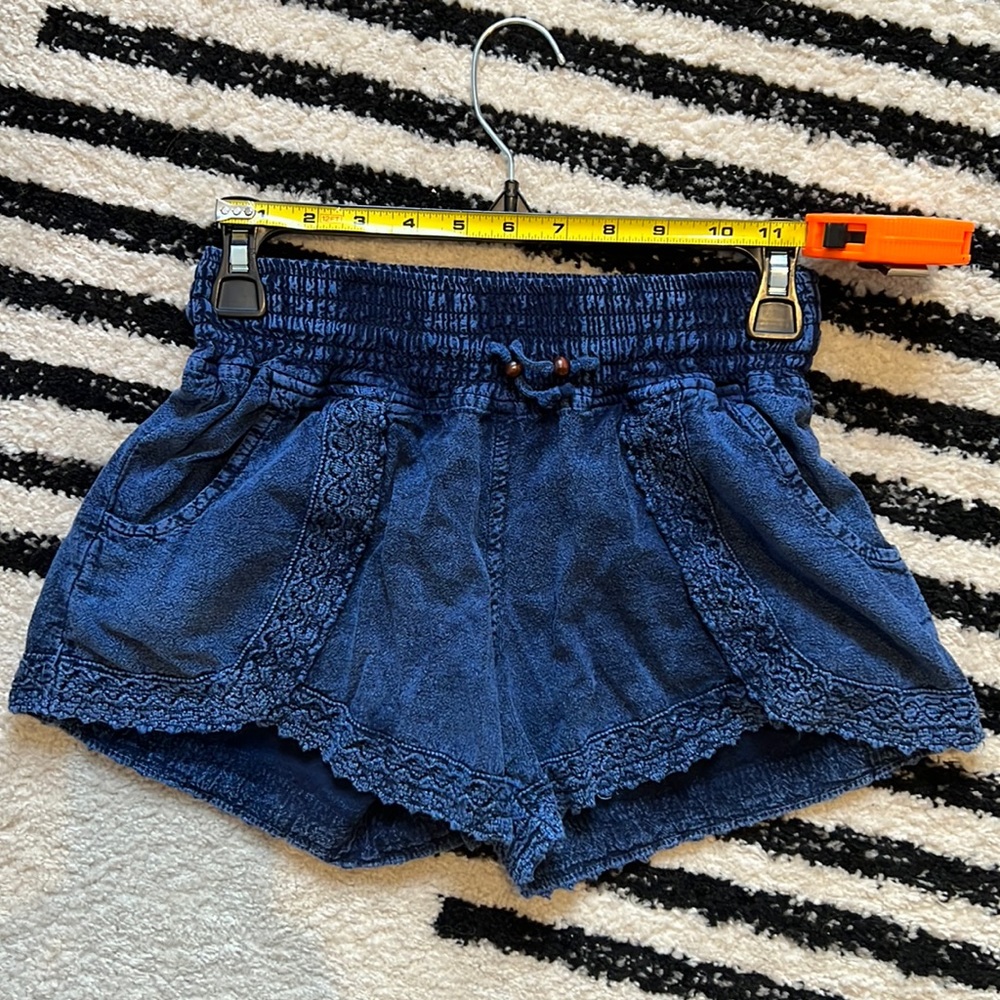 Blue fabric shorts with pockets